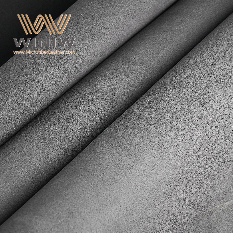 Grey microfiber suede surface for furniture upholstery evaluation Grey microfiber suede surface for furniture upholstery evaluation